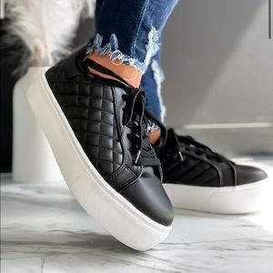 Black and white platform tennis shoes